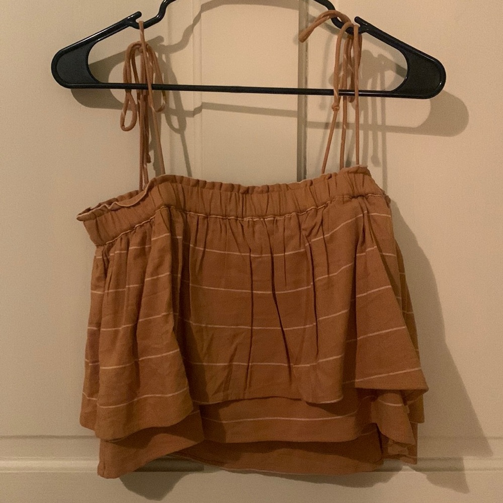 super cute mustard yellow and white striped flowy crop top with tie straps.